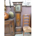 An early 20th century oak cased granddaughter clock with Westminster chime