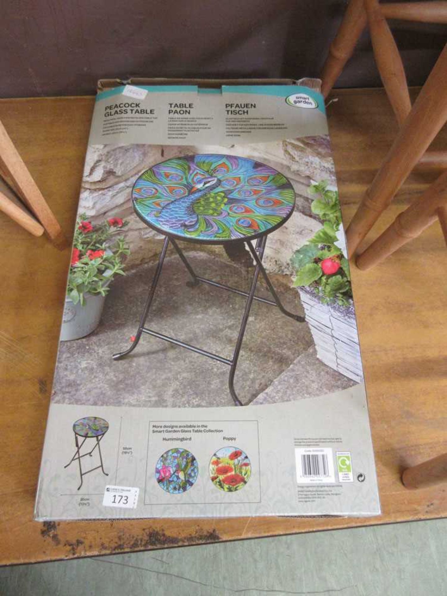 A boxed Smart Table Peacock glass table