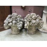 A pair of composite stone garden cornucopia