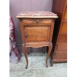 A pink marble topped French pot cupboard having small drawer above cupboard door