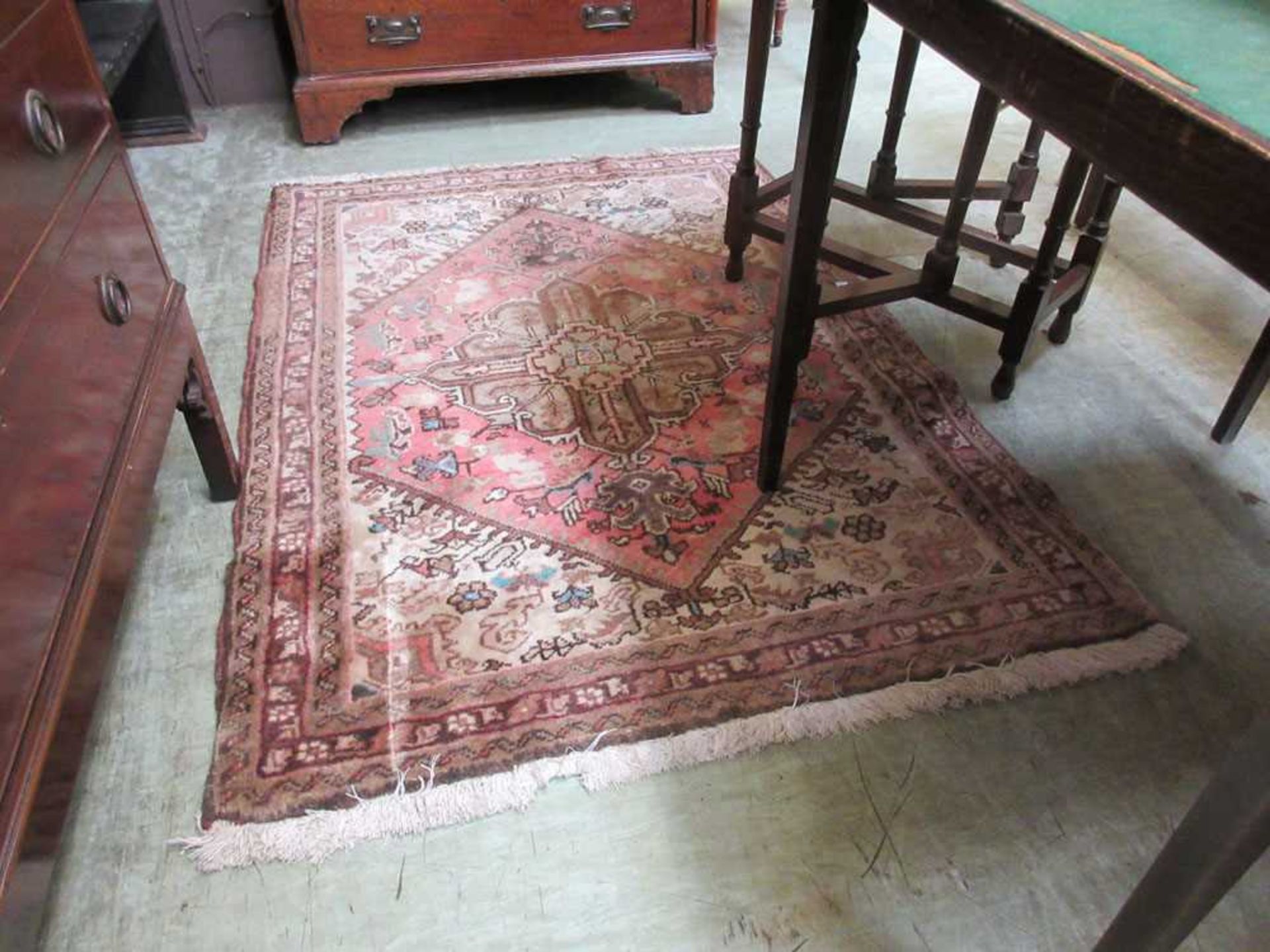 A brown and red ground rectangular rug