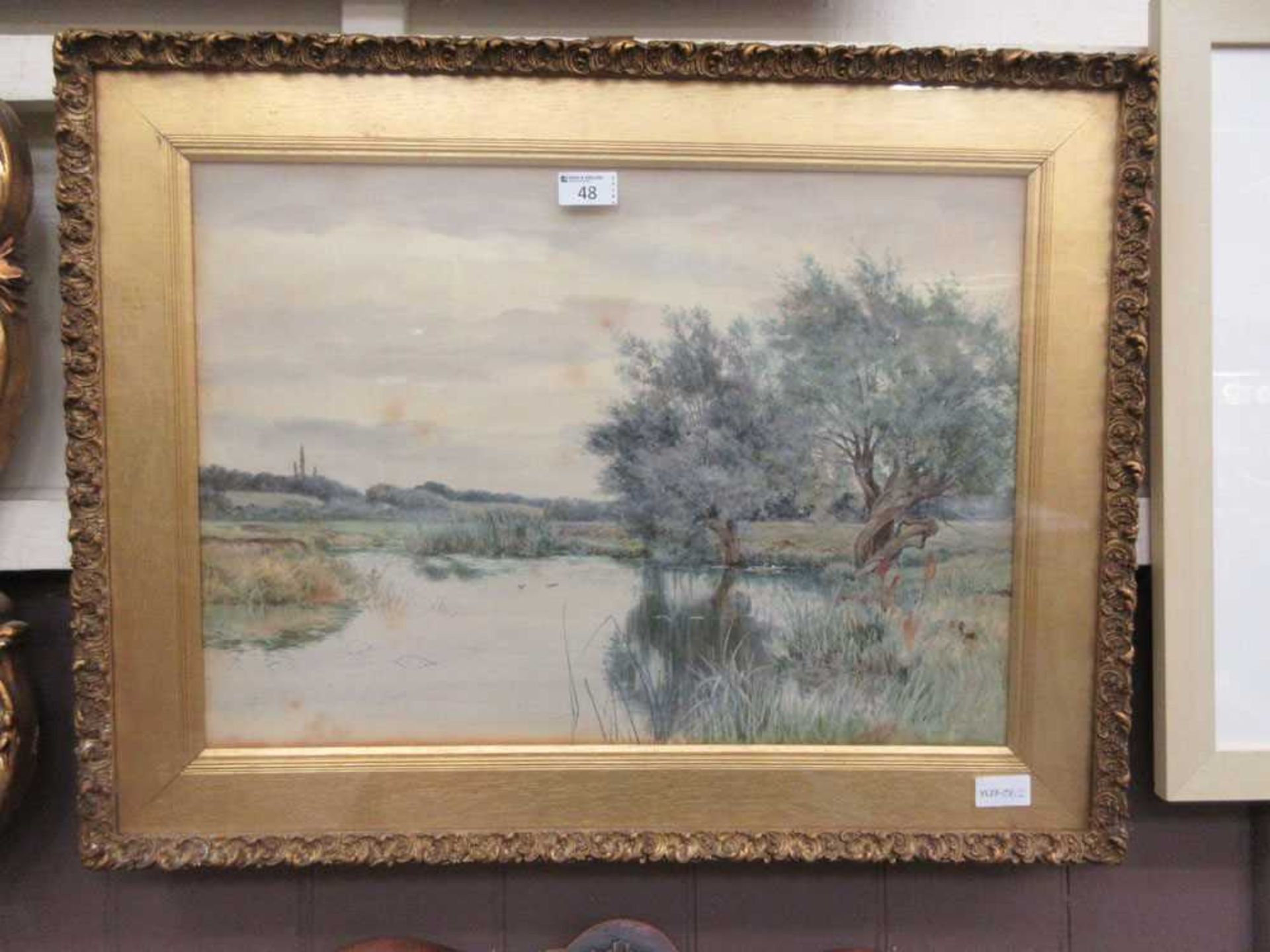 A framed and glazed watercolour of lake scene signed R W Fraser 'St Ives'