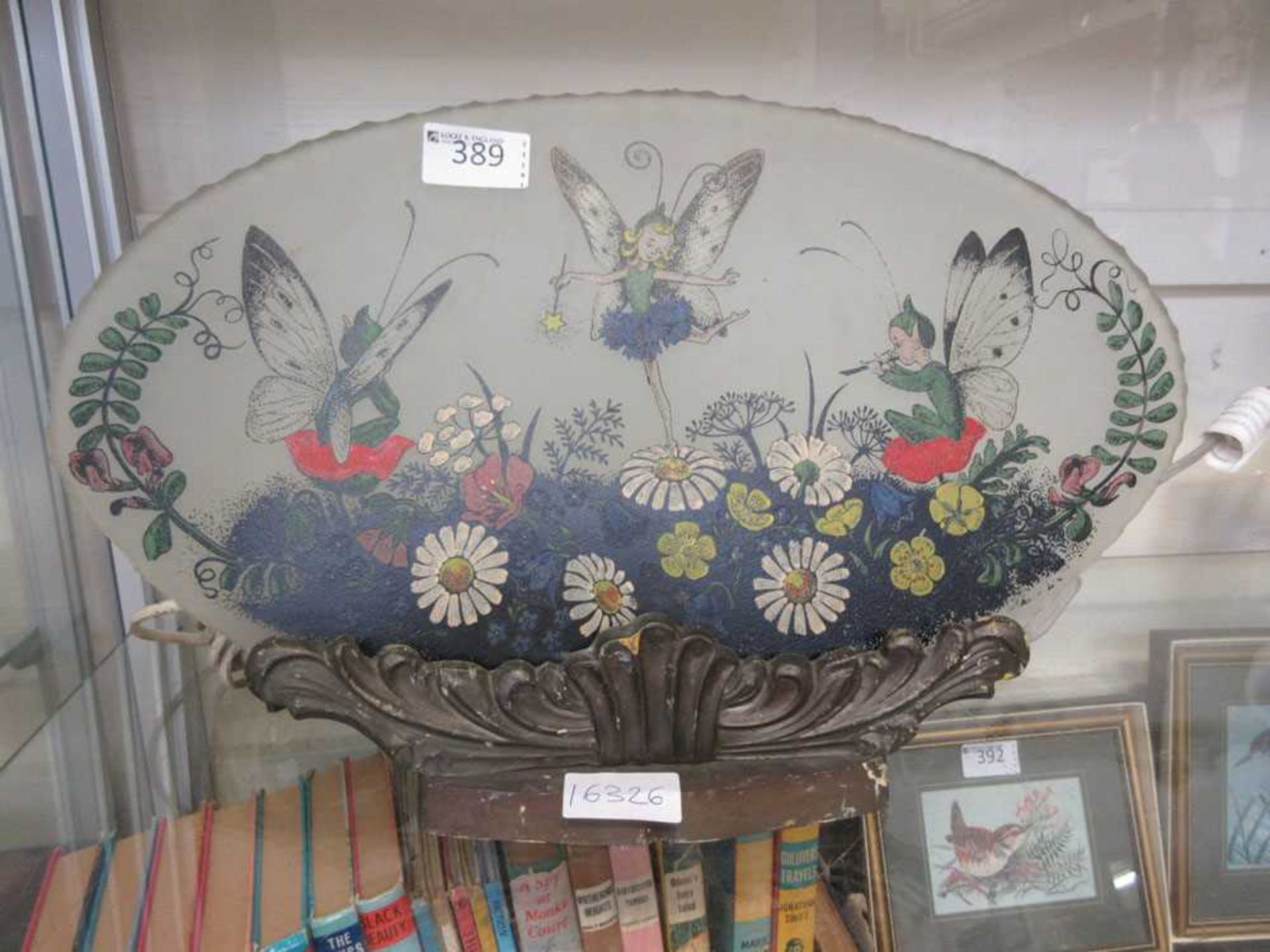 An early 20th century lamp in the form of fairy design on glass