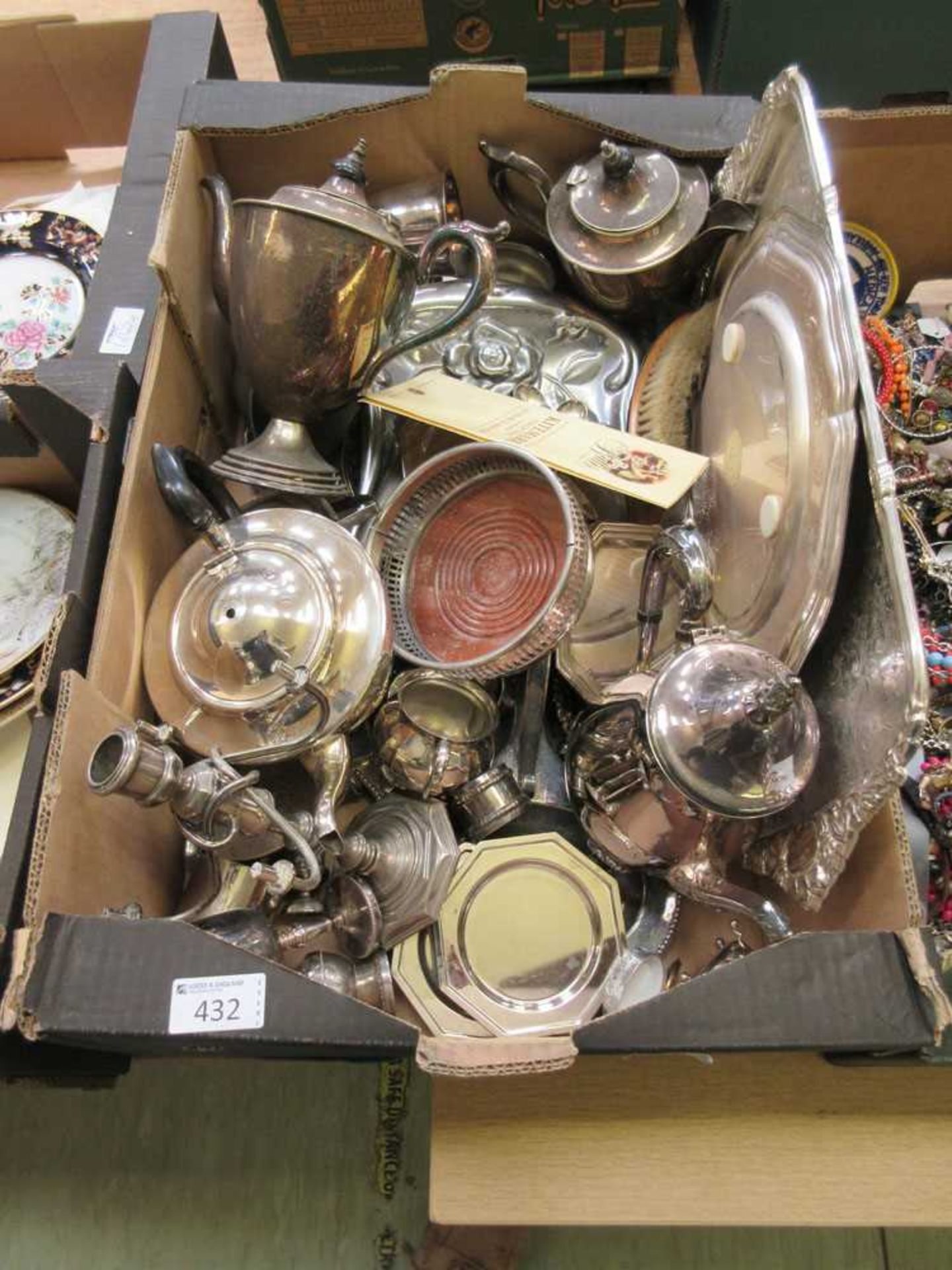 A tray containing a quantity of metal and plated ware to include coffee set, candlesticks, etc