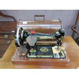 A cased Singer manual sewing machine