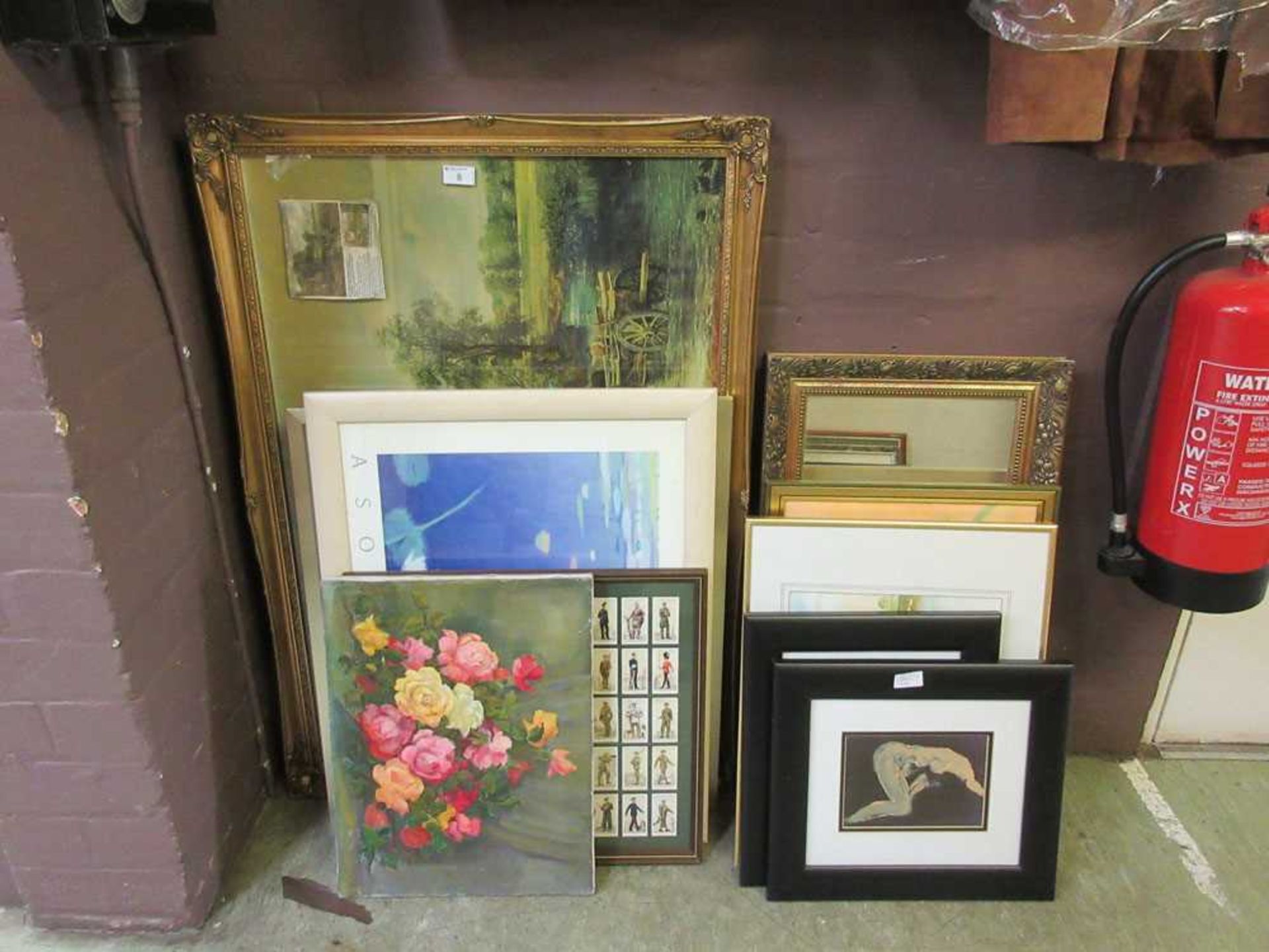 A large collection of artworks to include a large oil of still life, cigarette card display, prints,