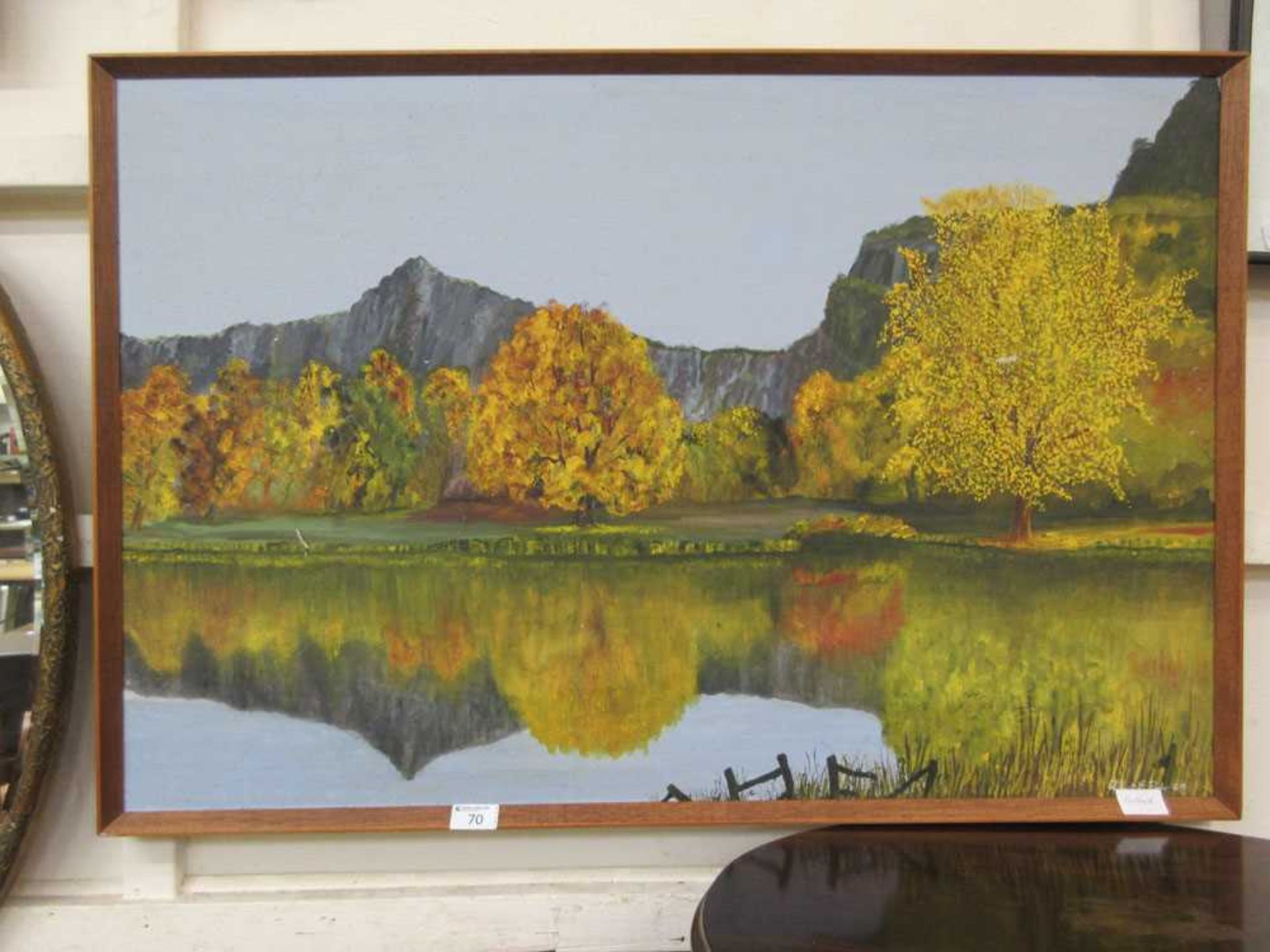 A framed oil on board of lake and tree scene signed bottom right Robert E Ryder 69