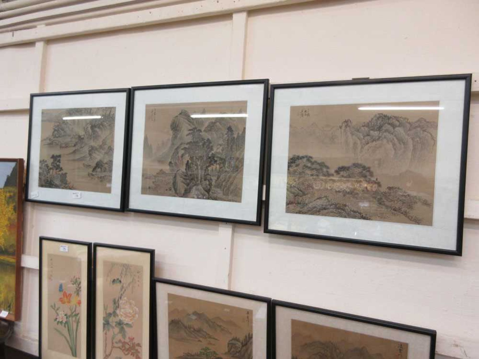 A set of three framed and glazed Japanese watercolours of scenery