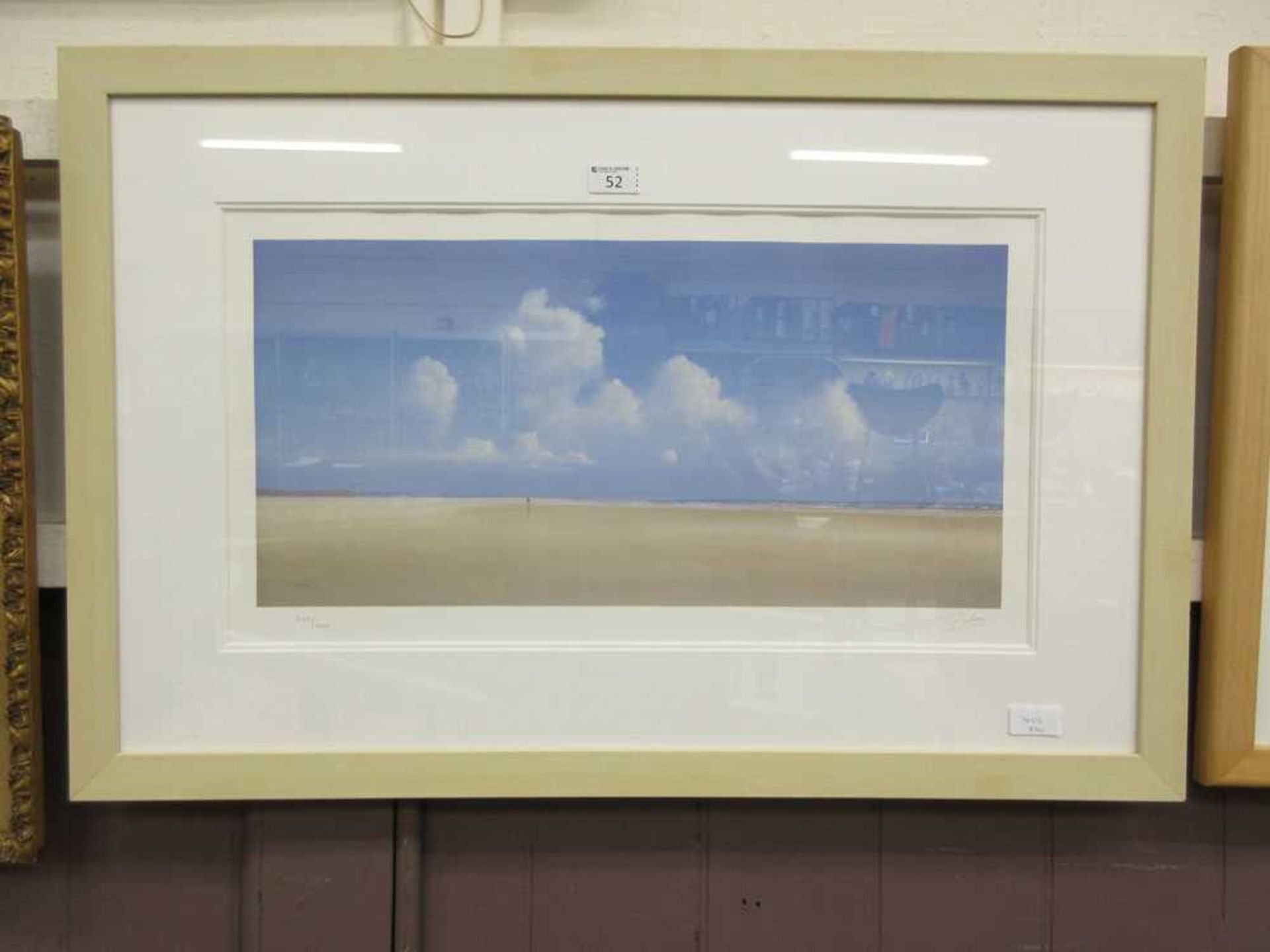 A framed and glazed limited edition medium photo lithograph of beach scene no.245/600 signed in