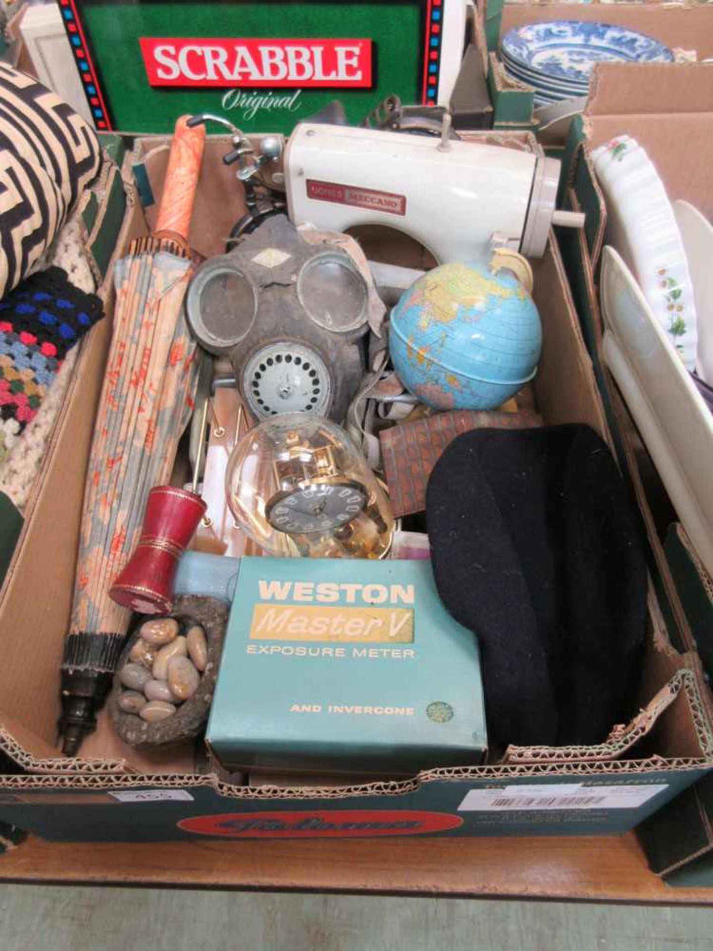 A tray containing parasol, Meccano, sewing machine, Viewmaster, etc