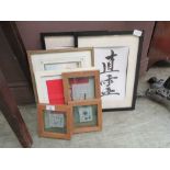 A collection of artworks to include Chinese writing, displays of stones etc.
