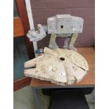 A Kenner Products Millennium Falcon along with a 1981 Kenner Products At-At