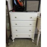 A white painted chest of four drawers