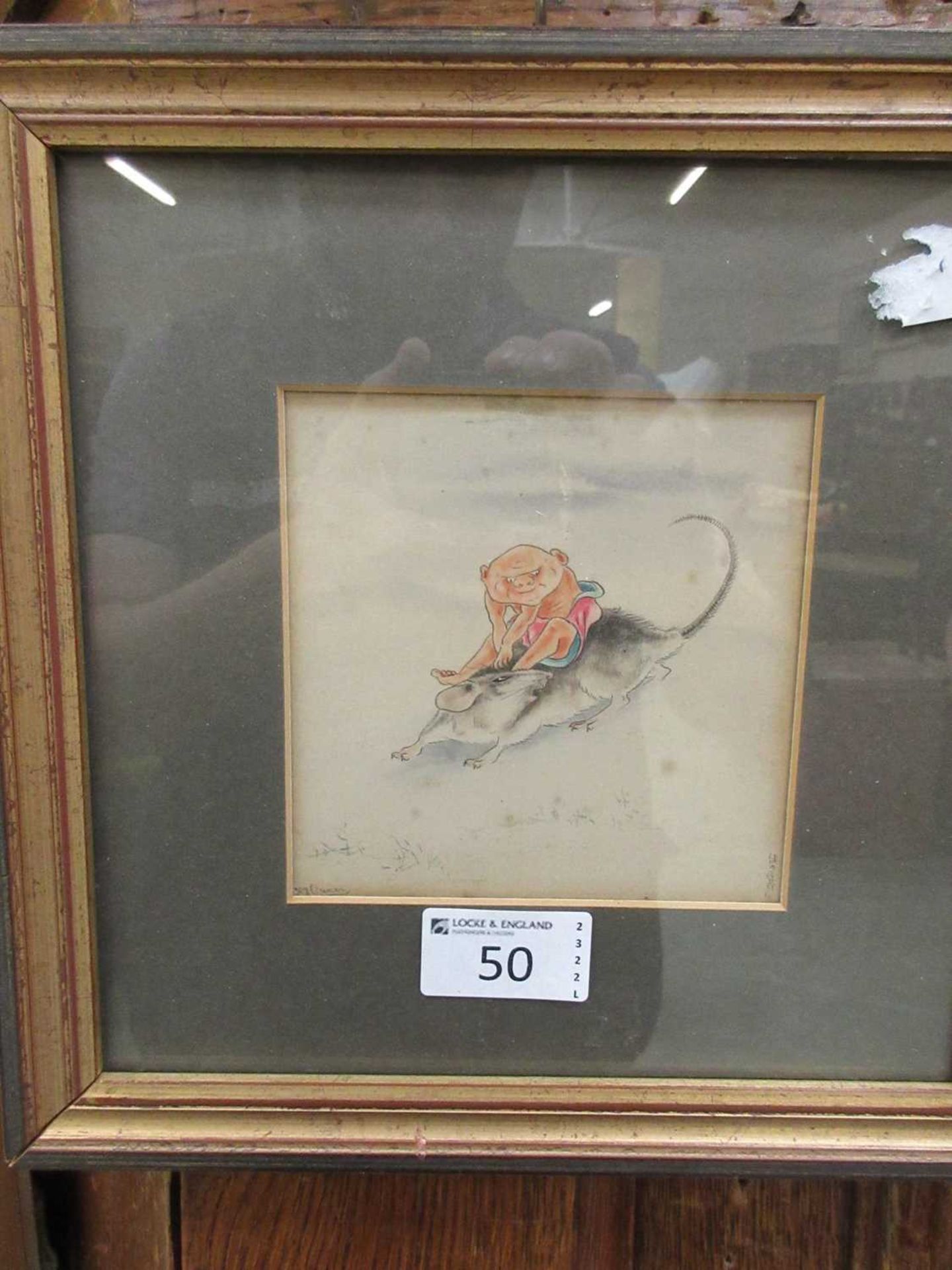 A framed and glazed possible pen and ink of creature riding a rat