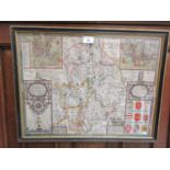 A framed and glazed coloured map of the county of Warwickshire by John Speed