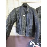A black leather RIOSSI motorcycle jacket.