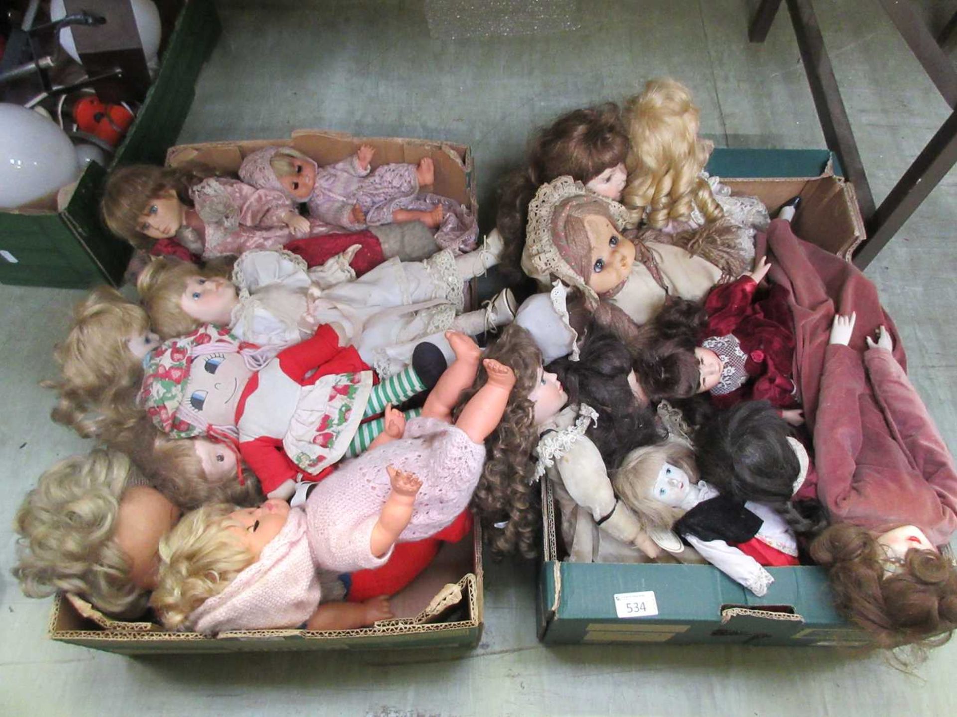 Two trays of dolls