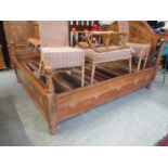 A French walnut inlaid bedstead