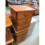 A pair of modern pine three drawer bedside chests