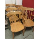 A set of four plus two pine dining chairs