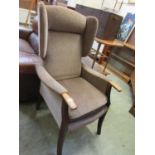 A high back wing armchair