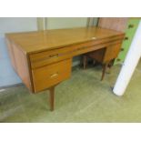 A mid-20th century teak dressing table