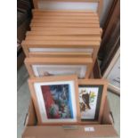 A tray containing a quantity of modern framed prints of various subjects, mainly birds.