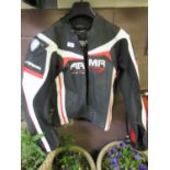 A black, white and red motorcycle jacket by ARMR-MOTO.