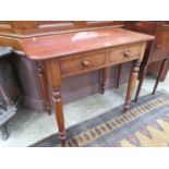 A late Victorian mahogany table having two drawers on turned supports