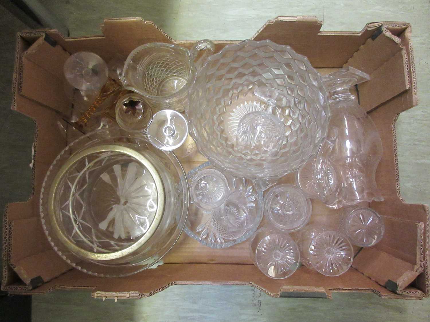 A tray containing pressed glassware to include drinking vessels, bowls, water jugs etc.