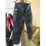 A pair of black leather motorcycle trousers by Hunter