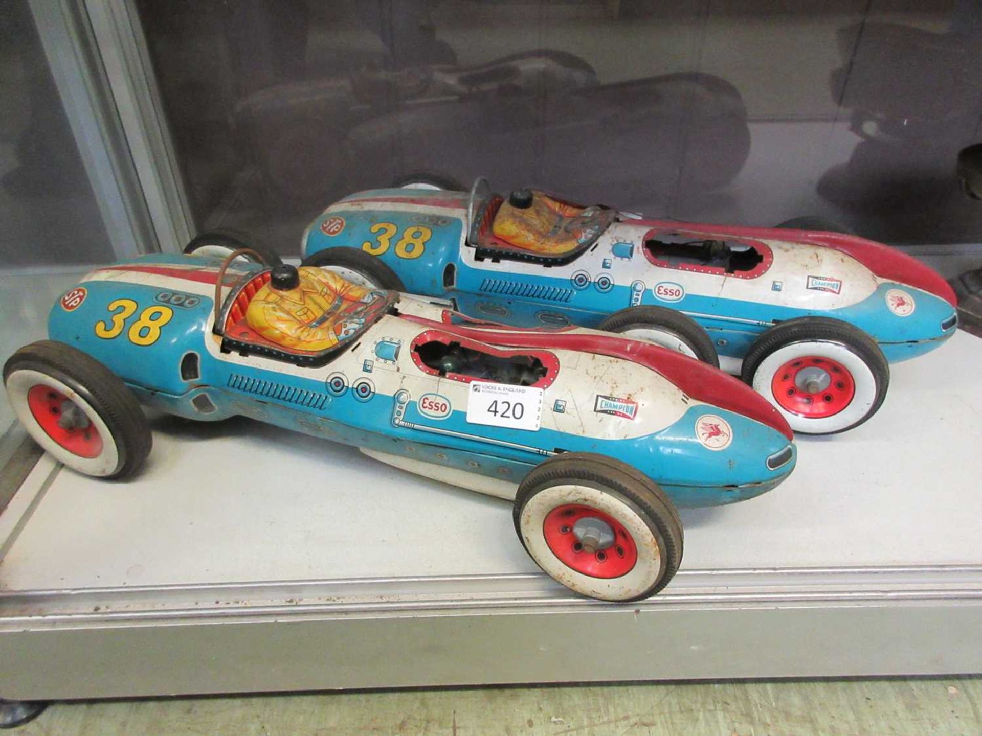 Two tin plate racing cars