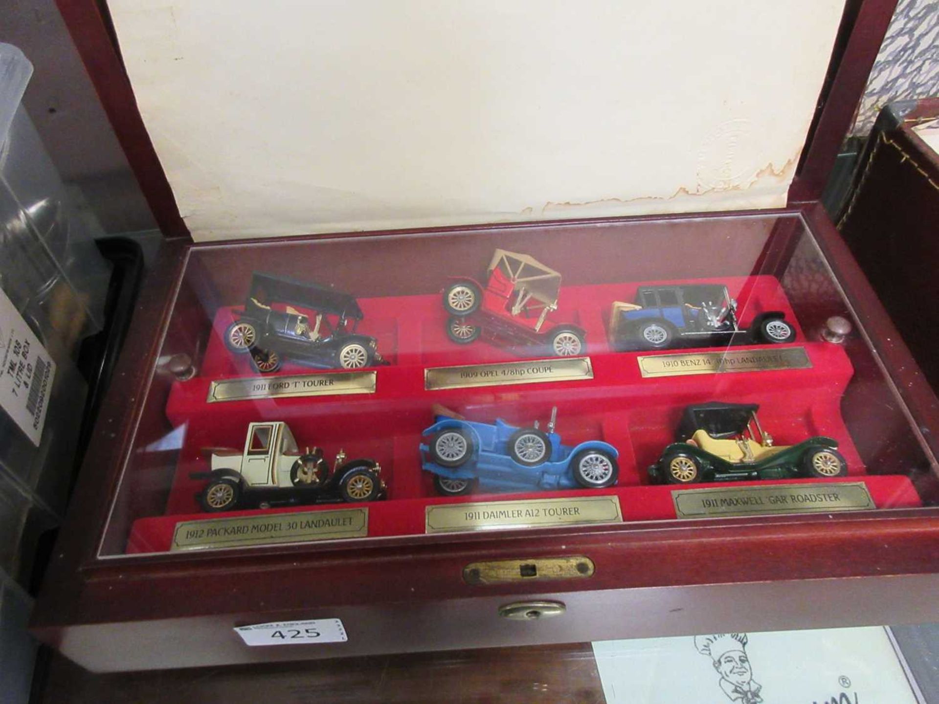 A wooden display case of Matchbox Yesteryear cars