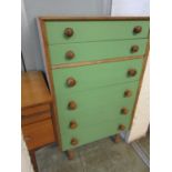 A mid-20th century chest of six drawers having green painted fronts