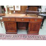 A mahogany twin pedestal desk