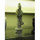 A white ceramic oriental style figurine of a gentleman