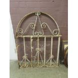 A pair of wrought iron garden gates