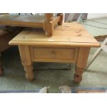 A modern pine lamp table with side drawer