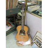 A steel string acoustic guitar (A/F)