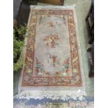 A beige ground Chines style rug