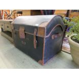 A 19th century oilskin and leather domed top travelling trunk by Denty