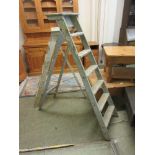 A pine set of decorator's step ladders