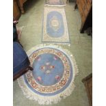 A blue ground Chinese style rug along with a circular Chinese style rug