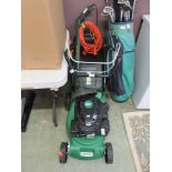 A Hawksmoore petrol lawnmower together with a Black and Decker strimmer