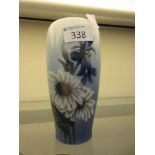 A blue and white glazed Royal Copenhagen vase with floral design