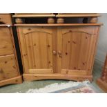 A modern pine two door cabinet