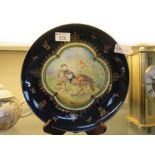 A blue and gilt design plate depicting partridges, made by Alexandra Porcelain Works