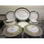 A part Wedgwood and Co. dinner service having gilt rimmed design