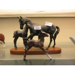 A Beswick model of a bay foal along with a Beswick 'Connoisseur' model 'Black Beauty And Foal'