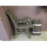 A pair of cast metal garden seats (A/F)